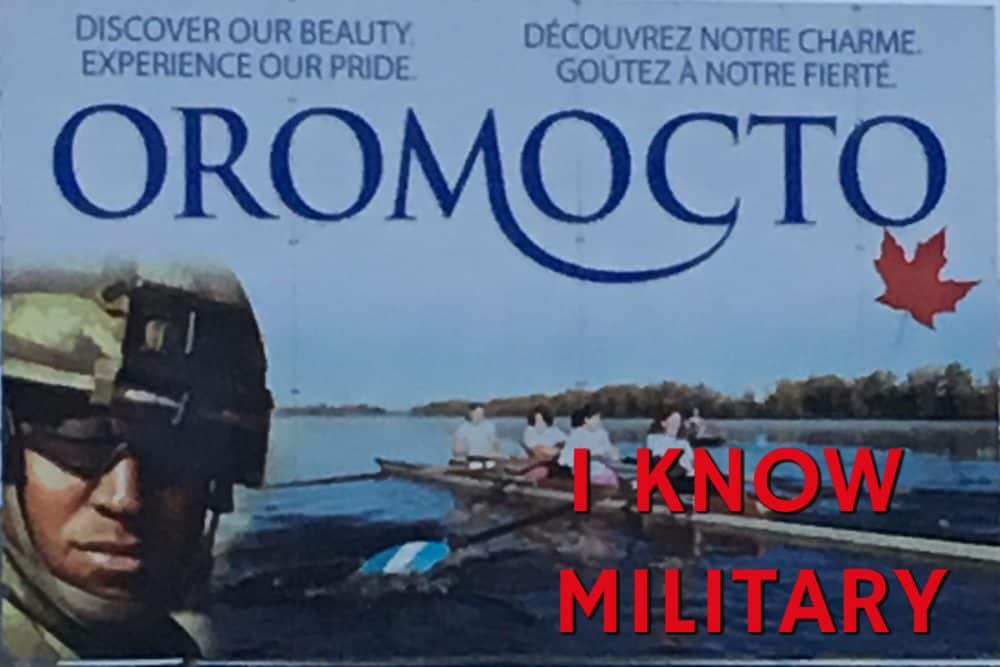 Oromocto, a Model Town, highway sign with 'I Know Military' added.