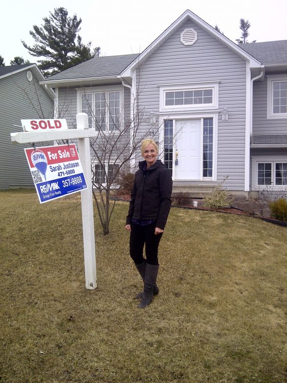 Home Sold Sign with Happy Client